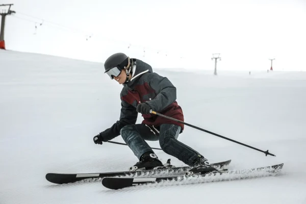full-shot-smiley-skier-with-equipment-scaled
